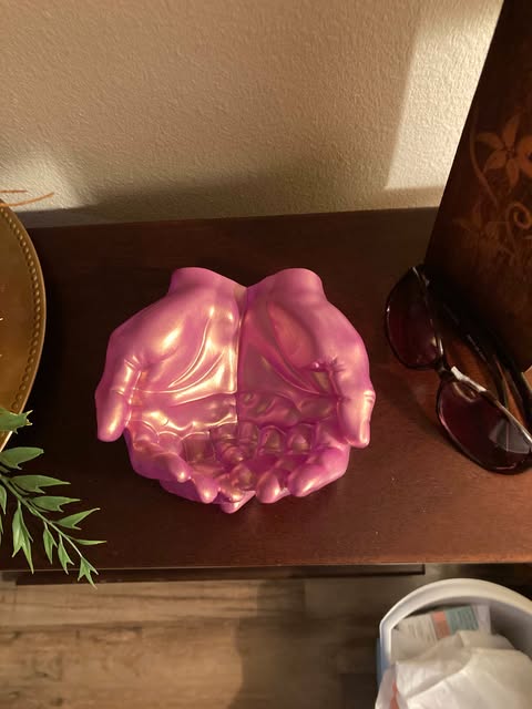 Elegant resin dish shaped like hands, perfect for gifting or as a decorative accent in any room