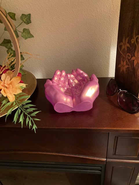 Elegant resin dish shaped like hands, perfect for gifting or as a decorative accent in any room